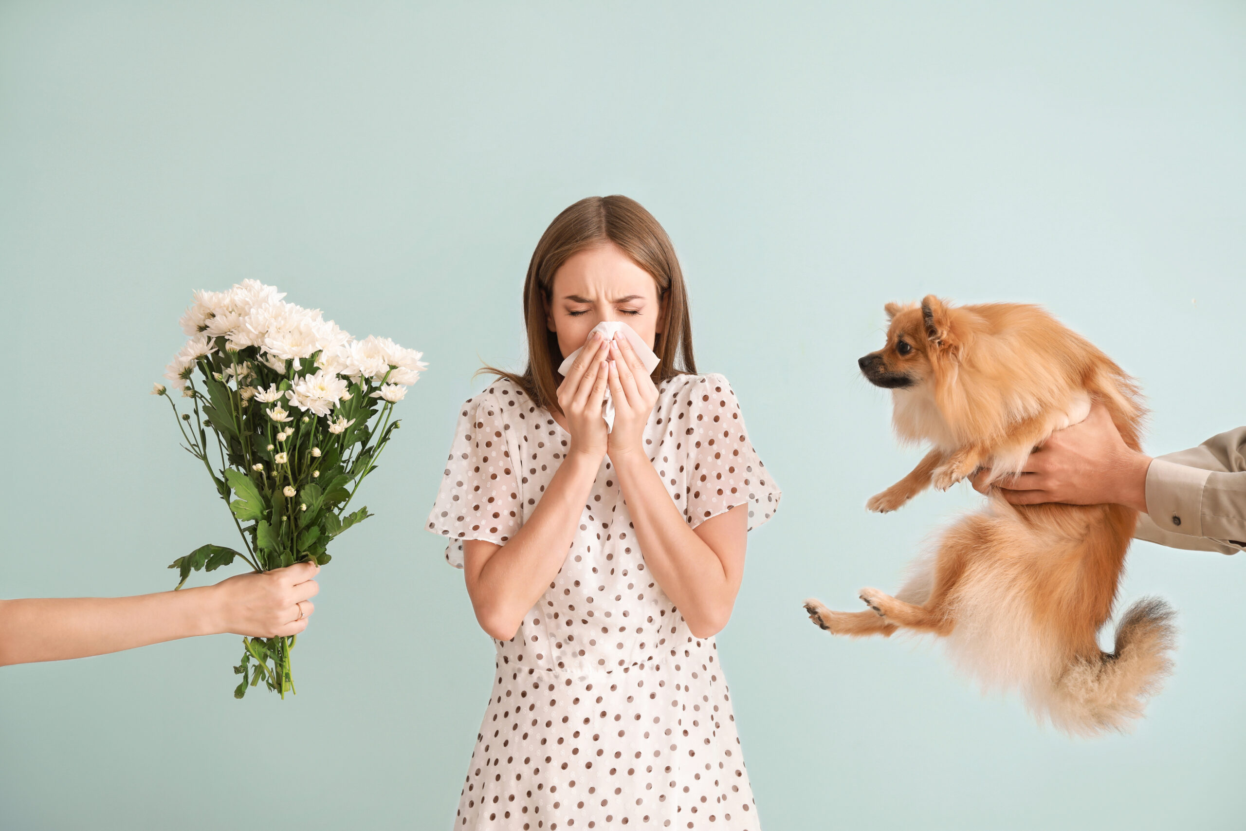 People giving flowers and dog to young woman suffering from alle